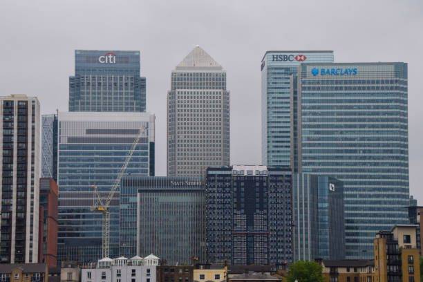 London, UK daytime view of corporate skyscrapers, banking headquarters and offices in Canary Wharf these building's has office's which would be good for Office Clearance