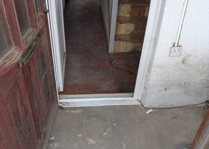 a clear, clean and tidy area at a door after a waste removal