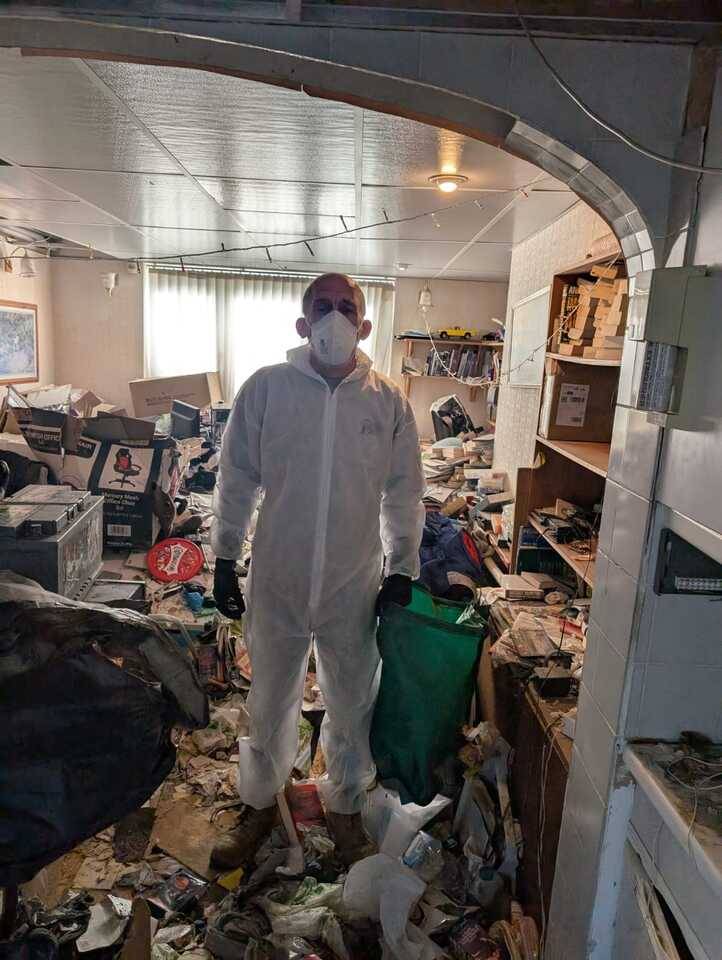 An-essex-waste-man-worker-standing-with-full-protective-clothing-as-he-removes-rubbish.jpg