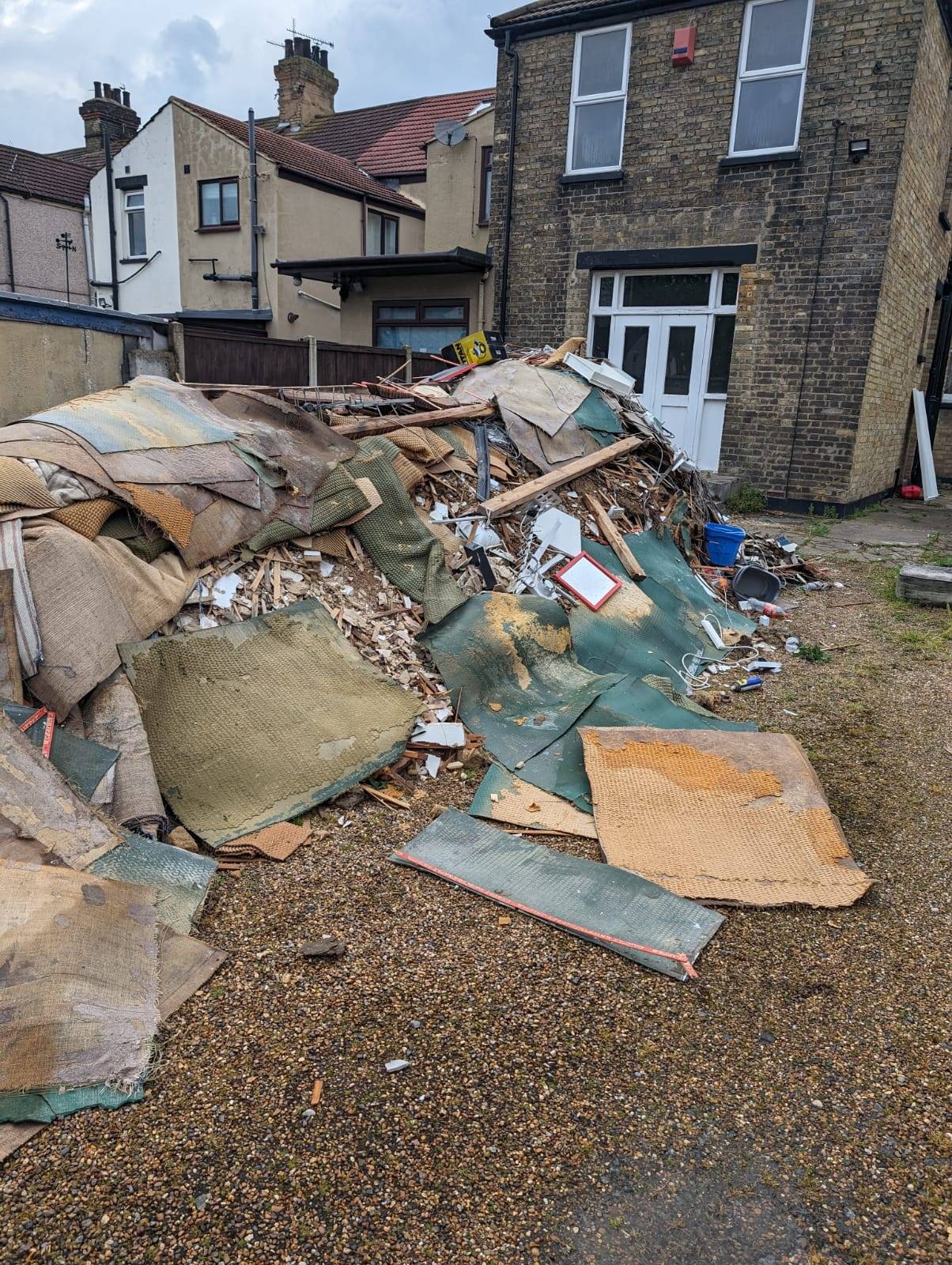 Rubbish piled up outside of a house