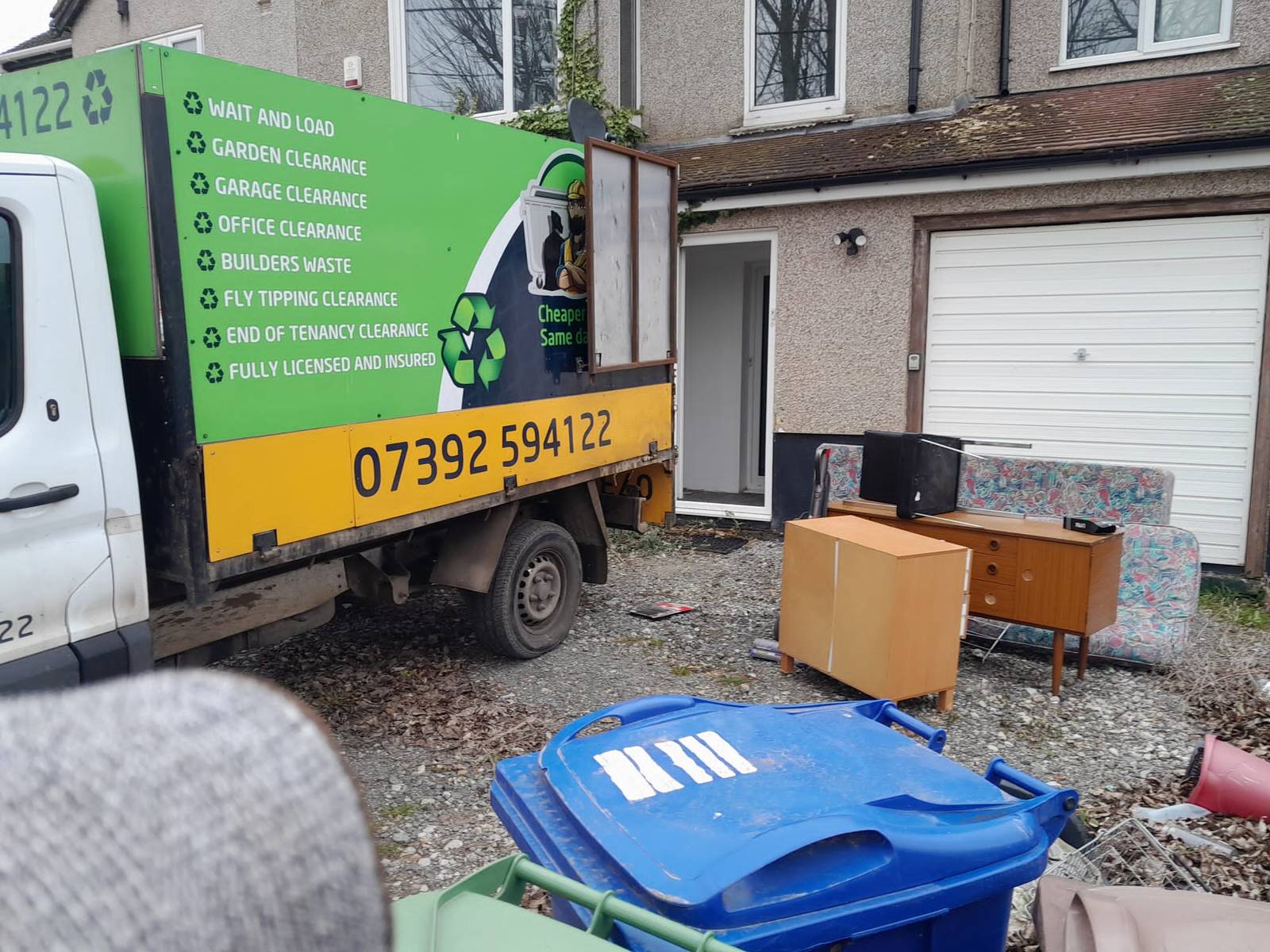 Essex waste man van parked in front of a house