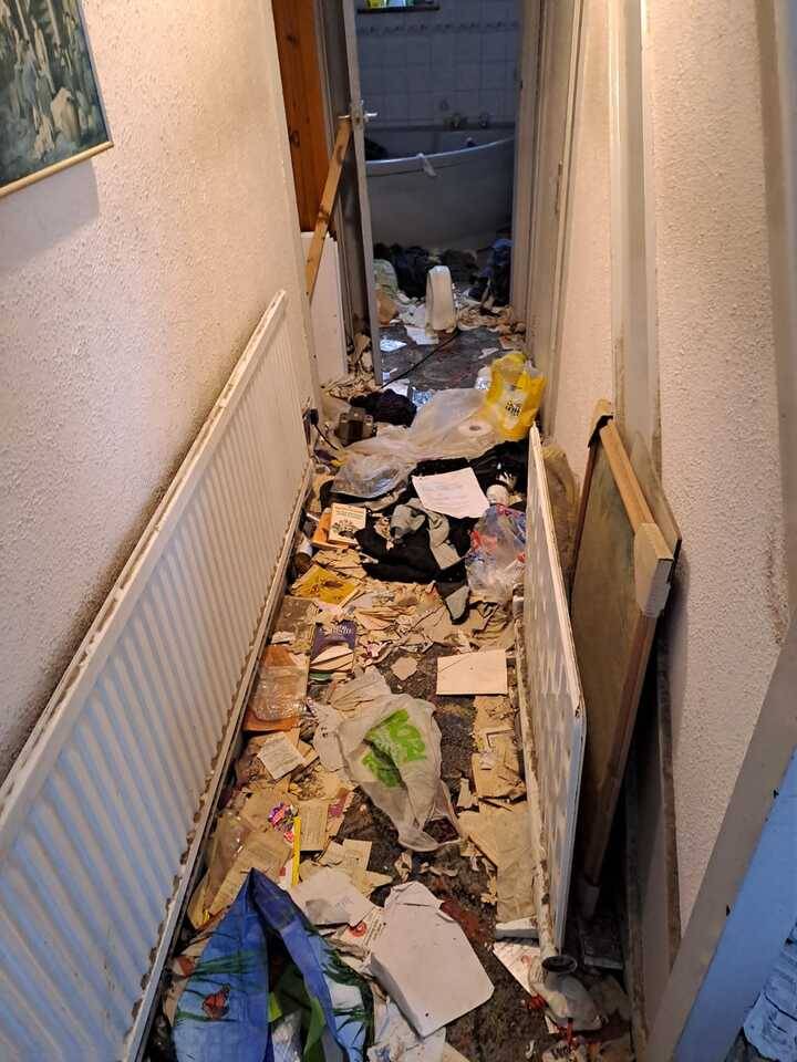 a-house-hallway-covered-in-waste-in-need-of-rubbish-removal-house-clearance-service.jpg